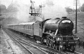 An impression of the “Flying Scotsman” - the LNER’s most famous express - passing signals at speed near London