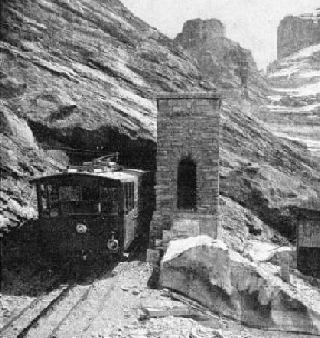 TRAIN EMERGING from one of the numerous tunnels on the Jungfrau Railway