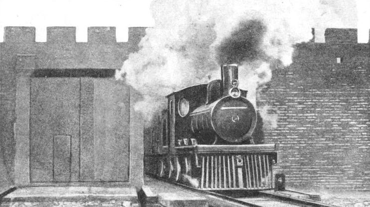 A Hankow train passing through an ancient rampart at Peking