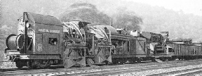 a machine in action renewing ballast on the lines of the Pennsylvania Railroad