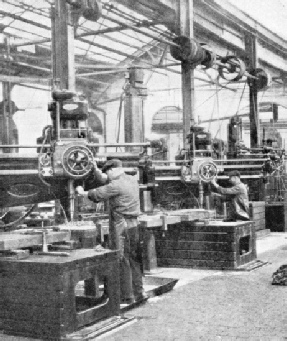 Radial drills at work on four locomotive frames