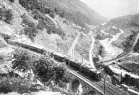 SPIRAL ASCENT. The train shown in this picture is travelling northwards towards Lucerne, and has traversed two spiral tunnels inside the mountain