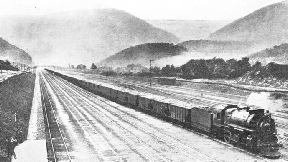 A LONG FREIGHT TRAIN of one hundred coal wagons on the Middle Division of the Pennsylvania Railroad system