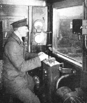 A MOTORMAN at the controls of a Southern electric train