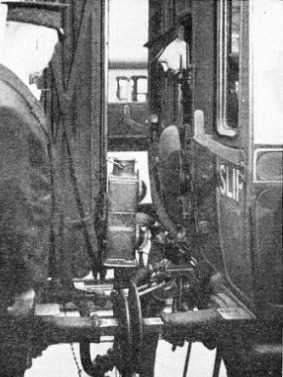 The slip coach is seen being coupled to the main train