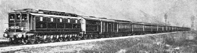 A TWENTY-WHEELED ELECTRIC LOCOMOTIVE hauls the “Rome Express” on the PLM section between Chambery and Modane