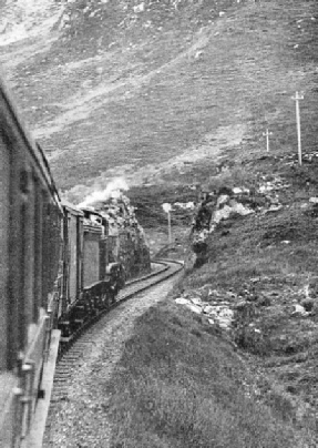 A London and North Eastern Railway train passing along a stretch of line between the stations of Arisaig and Mallaig