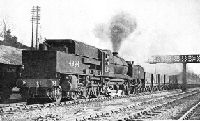 MODERN “BEYER-GARRATT” articulated engine of the 2-6-0 + 0-6-2 type, hauling a coal train on the LMS line