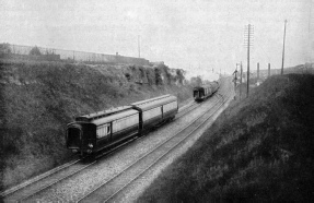 SLIPPING TWO COACHES OFF THE UP AMERICAN MAIL WHILE TRAVELLING AT 60 MILES PER HOUR