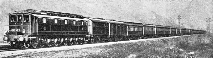 A TWENTY-WHEELED ELECTRIC LOCOMOTIVE hauls the “Rome Express” on the PLM section between Chambery and Modane