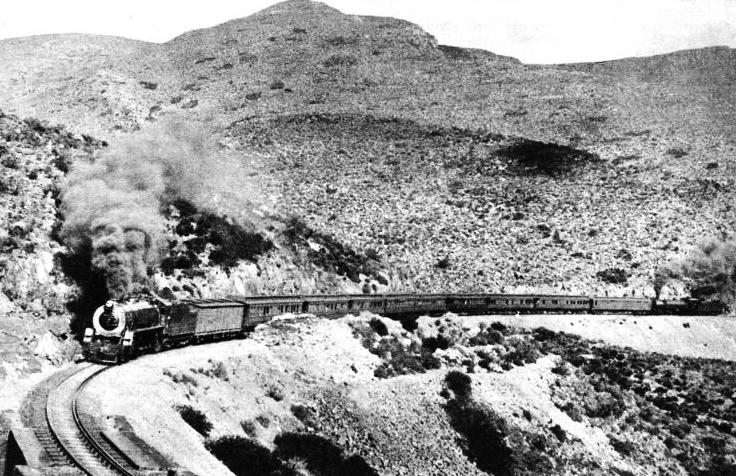 The railway overcomes the slopes of the mighty Matrooseberg by means of the Hex River Pass