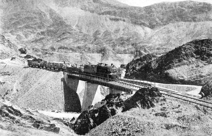 A local train is crossing a bridge not far from Shahgai, on the Khyber Railway