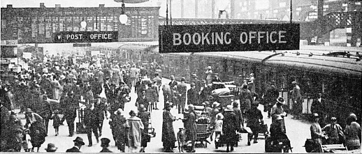A HOLIDAY SCENE AT LIVERPOOL STREET STATION