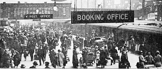 A HOLIDAY SCENE AT LIVERPOOL STREET STATION