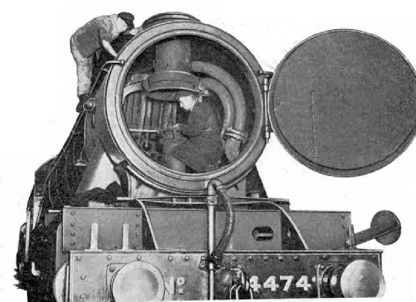 Cleaning the inside of the smoke-box of LNER No. 4474, Victor Wild