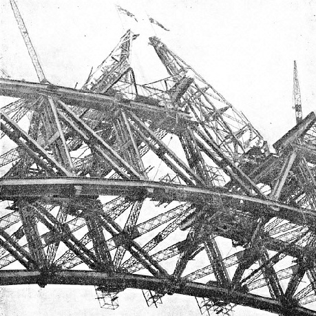 FLAGS WERE FLOWN on the creeper cranes to denote the permanent closing of the lower chords of the arch on the Sydney Harbour bridge