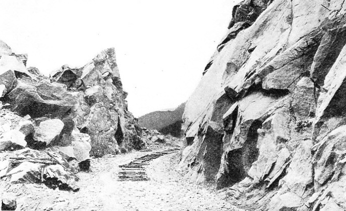 A new cutting, freshly blasted and levelled on a ridge of the Rocky Mountains