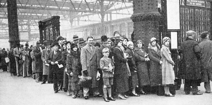 a typical crowd queuing up for a holiday train at Waterloo Station