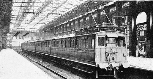 “OVERHEAD” ELECTRIC TRAIN ON THE BRIGHTON SECTION OF THE SOUTHERN RAILWAY