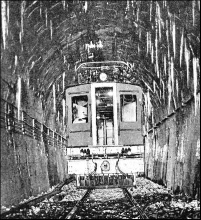 THE LONGEST RAILWAY TUNNEL in the British Empire is the Otira Tunnel in the South Island of New Zealand