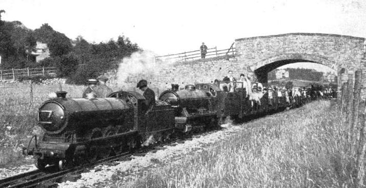 DOUBLE HEADING. Two fine locomotives with a train-load of holiday-makers on the Eskdale Railway
