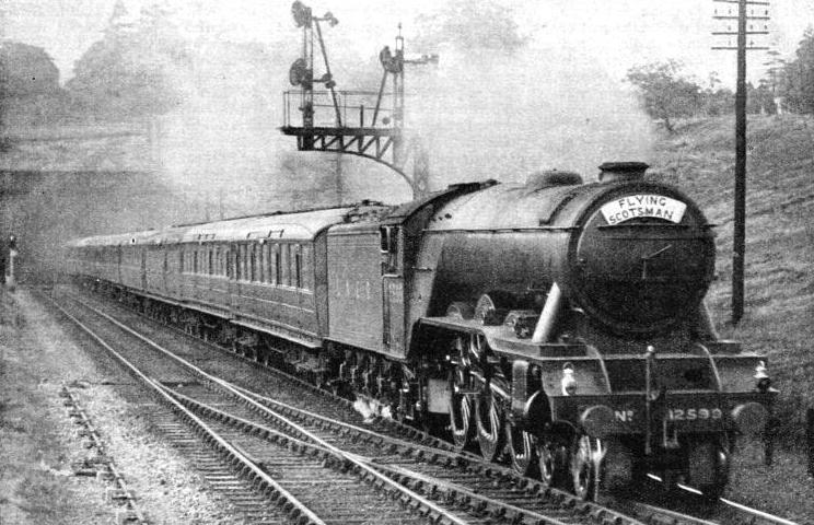 An impression of the “Flying Scotsman” - the LNER’s most famous express - passing signals at speed near London