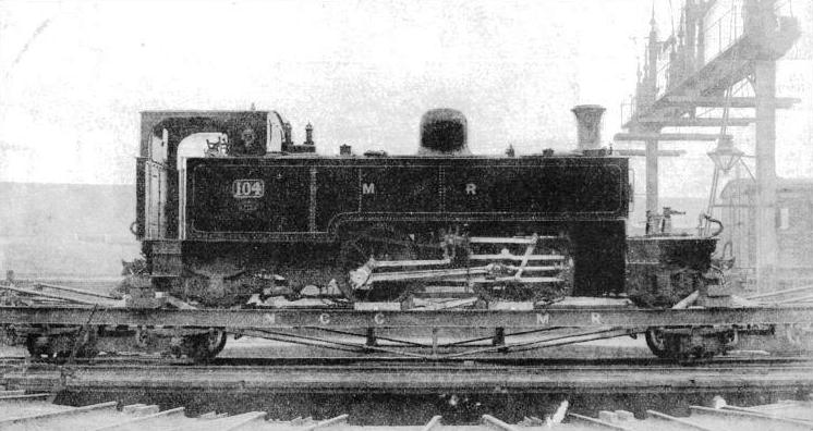 A narrow-gauge 2-4-2 compound engine on a broad-gauge transhipment truck at Belfast