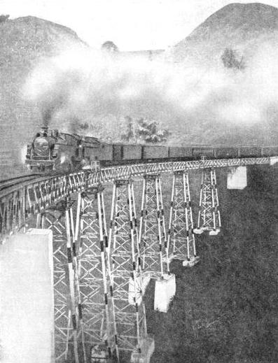 CROSSING A VIADUCT in the Preanger Mountains, Java