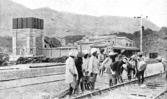 INDIAN LABOURERS AT WORK, renewing the ballast of the permanent way in a typical siding