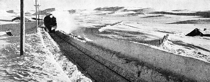 A SNOW CUTTING is being threaded by an express on the Oslo-Bergen Railway