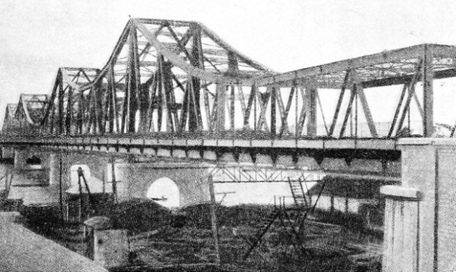 THE RAMA VI BRIDGE which crosses the Menam Chao Phya River at Bangkok